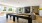 apartment clubhouse with large TV and seating with shuffleboard table